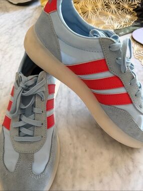 adidas light blue sneakers with coral red accents